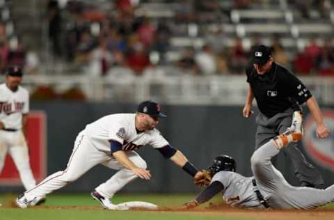 MINNEAPOLIS, MN – JULY 22: Brian Dozier #2 of the Minnesota Twins tags out Jose Iglesias #1 of the Detroit Tigers at second base as umpire Jeff Kellogg #8 looks on during the ninth inning of the game on July 22, 2017 at Target Field in Minneapolis, Minnesota. The Twins defeated the Tigers 6-5. (Photo by Hannah Foslien/Getty Images)