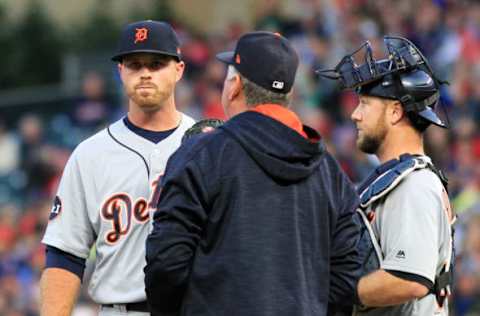 MINNEAPOLIS, MN – SEPTEMBER 30: Buck Farmer #45 of the Detroit Tigers listens to Rich Dubee pitching coach for the Detroit Tigers and Bryan Holaday #50 of the Detroit Tigers after Farmer walked in a run for the Minnesota Twins in the first inning during of their baseball game on September 30, 2017, at Target Field in Minneapolis, Minnesota.(Photo by Andy King/Getty Images)