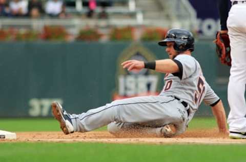 MINNEAPOLIS, MN – OCTOBER 1: Bryan Holaday #50 of the Detroit Tigers slides into third base against the Minnesota Twins in the fifth inning during their baseball game on October 1, 2017, at Target Field in Minneapolis, Minnesota.(Photo by Andy King/Getty Images)