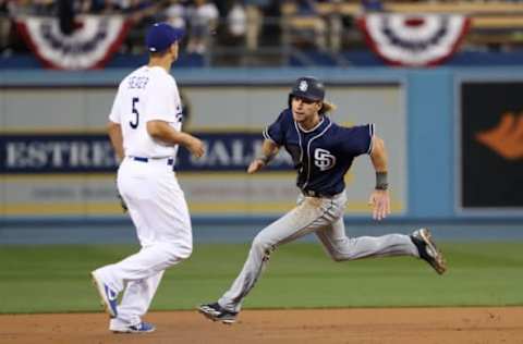 LOS ANGELES, CA – APRIL 04: Travis Jankowski #16 of the San Diego Padres runs toward third base on a single by teammate Wil Myers #4 (not in photo) as Corey Seager #5 of the Los Angeles Dodgers watches the ball go into right field during the first inning of their MLB game at Dodger Stadium on April 4, 2017 in Los Angeles, California. The Padres defeated the Dodgers 4-0. (Photo by Victor Decolongon/Getty Images)