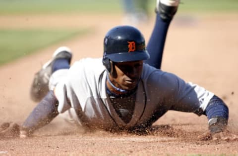 Curtis Granderson of the Detroit Tigers slides back into first base to avoid a tag during action on opening day against the Kansas City Royals at Kauffman Stadium in Kansas City, MO on April 3, 2006. (Photo by G. N. Lowrance/Getty Images)