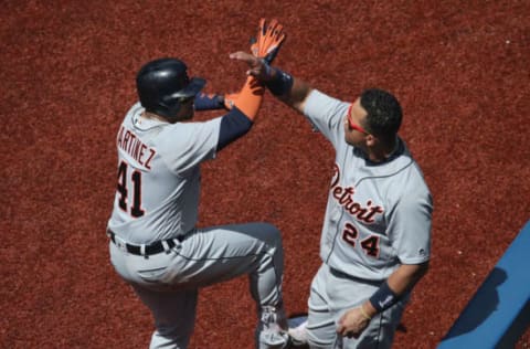 TORONTO, CANADA – JULY 9: Victor Martinez #41 of the Detroit Tigers is congratulated by Miguel Cabrera #24 after hitting a solo home run in the eighth inning during MLB game action against the Toronto Blue Jays on July 9, 2016 at Rogers Centre in Toronto, Ontario, Canada. (Photo by Tom Szczerbowski/Getty Images)