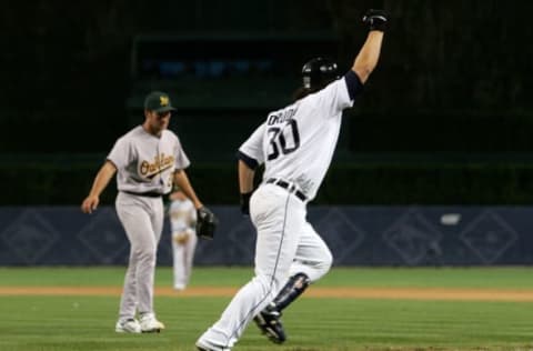 DETROIT – OCTOBER 14: Magglio Ordonez #30 of the Detroit Tigers rounds the base after he hit a walk off three run home run against Huston Street #20 (L) of the Oakland Athletics during Game Four of the American League Championship Series October 14, 2006 at Comerica Park in Detroit, Michigan. The Tigers won 6-3 to advance to the world series. (Photo by Jim McIsaac/Getty Images)