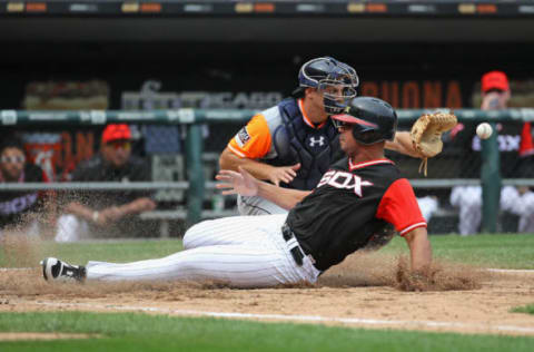 CHICAGO, IL – AUGUST 27: Jose Abreu #79 of the Chicago White Sox slides in to score a run in the 8th inning as John Hicks #55 of the Detroit Tigers takes the throw at Guaranteed Rate Field on August 27, 2017 in Chicago, Illinois. The White Sox defeated the Tigers 7-1. (Photo by Jonathan Daniel/Getty Images)