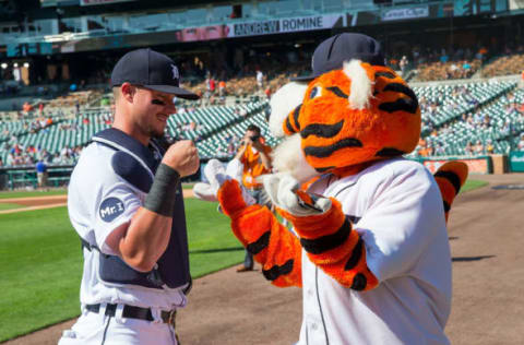 DETROIT, MI – SEPTEMBER 24: James McCann #34 of the Detroit Tigers pounds fist with Paws before a MLB game against the Minnesota Twins at Comerica Park on September 24, 2017 in Detroit, Michigan. (Photo by Dave Reginek/Getty Images)