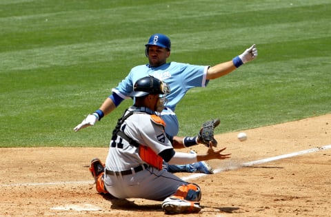 Catcher Victor Martinez takes the throw before tagging out James Loney on June 22, 2011 at Dodger Stadium. (Photo by Stephen Dunn/Getty Images)