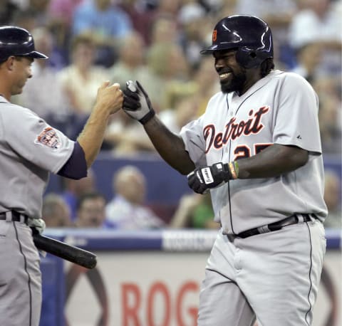 Dmitri Young is congratulated after hitting a home run, circa 2005. (Photo by Jay Gula/Getty Images)