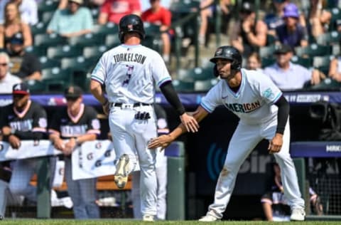 DENVER, CO – Riley Greene congratulates Spencer Torkelson after both scored against the National League Futures Team. (Photo by Dustin Bradford/Getty Images)