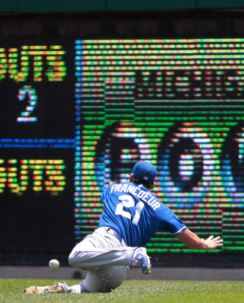 DETROIT, MI – JULY 08: Jeff Francoeur #21 of the Kansas City Royals can’t make the catch on a double to deep right-center field by Miguel Cabrera #24 of the Detroit Tigers in the third inning of the game at Comerica Park on July 8, 2012, in Detroit, Michigan. (Photo by Leon Halip/Getty Images)