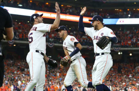 Houston Astros starting pitcher Justin Verlander celebrates as shortstop Carlos Correa runs to the dugout. Troy Taormina-USA TODAY Sports