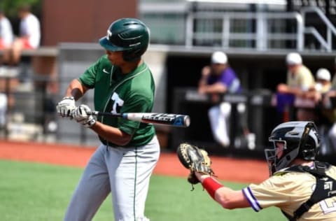 Trinity’s Daylen Lile takes a swing.