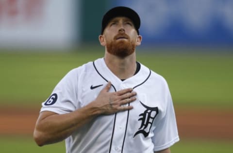 Jul 31, 2020; Detroit, Michigan, USA; Detroit Tigers starting pitcher Spencer Turnbull (56) looks up and taps his chest as he walks off the field during the first inning against the Cincinnati Reds at Comerica Park. Mandatory Credit: Raj Mehta-USA TODAY Sports