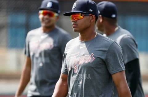 Infielder Wenceel Perez, center, warms up for practice during Detroit Tigers spring training at TigerTown in Lakeland, Fla., Thursday, Feb. 20, 2020.