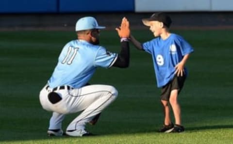 Erie SeaWolves center fielder Derek Hill high fives Tucker Froelich, 5, of the Erie Li’l SeaWolves before a game on Aug. 29, 2019, at UPMC Park. The SeaWolves, who didn’t play in 2020, will return for the 2021 season.Pw 1026509249