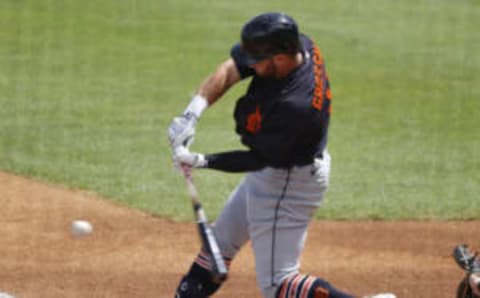 Mar 1, 2021; Tampa, Florida, USA; Detroit Tigers outfielder Robbie Grossman (8) singles against the New York Yankees during the first inning at George M. Steinbrenner Field. Mandatory Credit: Kim Klement-USA TODAY Sports