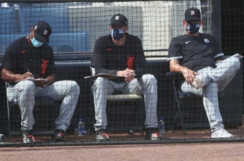 Detroit Tigers bench coach George Lombard pitching coach Chris Fetter and manager A.J. Hinch watch the game.