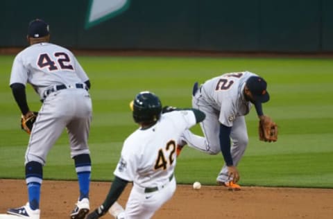 An error by Detroit Tigers shortstop Willi Castro lets Oakland Athletics second baseman Jed Lowrie reach second base. Kelley L Cox-USA TODAY Sports