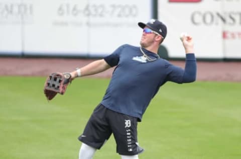 West Michigan Whitecaps outfielder Daniel Cabrera fields fly balls during practice.