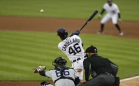 May 28, 2021; Detroit, Michigan, USA; Detroit Tigers third baseman Jeimer Candelario (46) hits an RBI single during the third inning against the New York Yankees at Comerica Park. Mandatory Credit: Raj Mehta-USA TODAY Sports