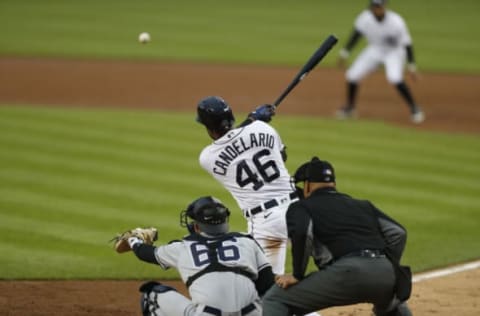 May 28, 2021; Detroit, Michigan, USA; Detroit Tigers third baseman Jeimer Candelario (46) hits an RBI single during the third inning against the New York Yankees at Comerica Park. Mandatory Credit: Raj Mehta-USA TODAY Sports