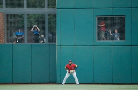 Toledo Mud Hens Christin Stewart (20) has company in right field as people watch from behind the screens on Nationwide Boulevard during the AAA minor league baseball game at Huntington Park in Columbus on Tuesday, June 15, 2021.Columbus Clippers Vs Toledo Mudhens