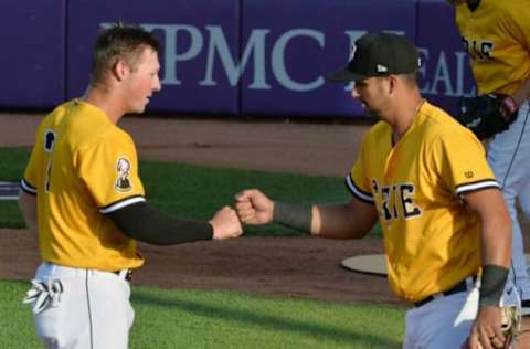 After hitting an RBI single against the Altoona Curve in the first inning, Erie SeaWolves batter Spencer Torkelson, left, greets teammate Drew Ward coming out of the dugout on June 16, 2021, at UPMC Park in Erie.