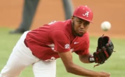 Alabama pitcher Dylan Smith makes a pitch vs. Ole Miss on March 26, 2021.