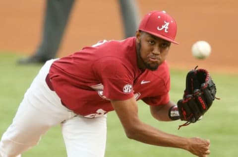 Alabama pitcher Dylan Smith makes a pitch vs. Ole Miss on March 26, 2021.