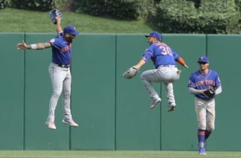 New York Mets left fielder Dominic Smith celebrates with right fielder Michael Conforto and center fielder Brandon Nimmo. Charles LeClaire-USA TODAY Sports