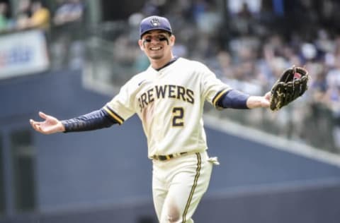 Aug 4, 2021; Milwaukee, Wisconsin, USA; Milwaukee Brewers’ third baseman Luis Urias (2) reacts between innings during the game against the Pittsburgh Pirates at American Family Field. Mandatory Credit: Benny Sieu-USA TODAY Sports