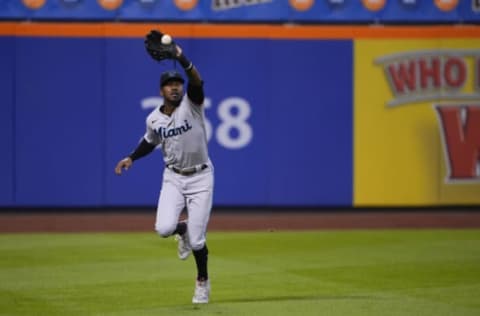 Aug 31, 2021; New York City, New York, USA; Miami Marlins left fielder Lewis Brinson (25) catches a fly ball hit by New York Mets first baseman Pete Alonso (not pictured) during the first inning at Citi Field. Mandatory Credit: Gregory Fisher-USA TODAY Sports