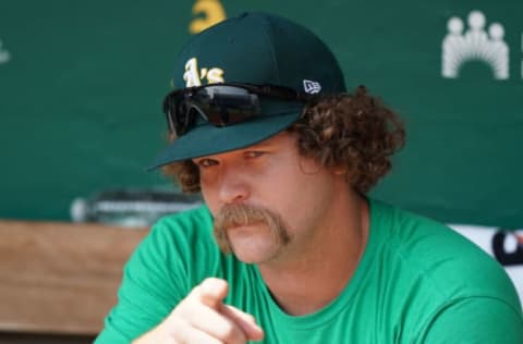 Relief pitcher Andrew Chafin sits in the dugout. Darren Yamashita-USA TODAY Sports