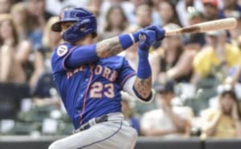 Sep 26, 2021; Milwaukee, Wisconsin, USA; New York Mets shortstop Javier Baez (23) hits a double to drive in 2 runs in the fourth inning against the Milwaukee Brewers at American Family Field. Mandatory Credit: Benny Sieu-USA TODAY Sports