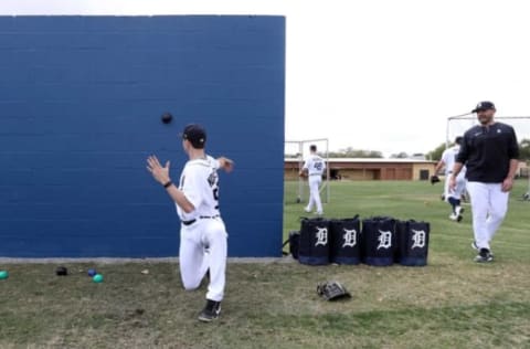 Tigers director of pitching Gabe Ribas watches pitching prospect Tanner Kohlhepp throwing weighted balls against a wall during practice at the spring training minor league minicamp Thursday, Feb.17, 2022 at Tiger Town in Lakeland, Florida.