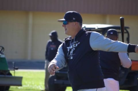 Detroit Tigers manager AJ Hinch hits ground balls to his players on spring training report date Sunday, March 13, 2022, in Lakeland, Florida.