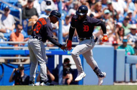 Mar 25, 2022; Dunedin, Florida, USA; Detroit Tigers center fielder Akil Baddoo (60) is congratulated by third base coach Ramon Santiago (39) after hitting a home run in the first inning against the Toronto Blue Jays during spring training at TD Ballpark. Mandatory Credit: Nathan Ray Seebeck-USA TODAY Sports