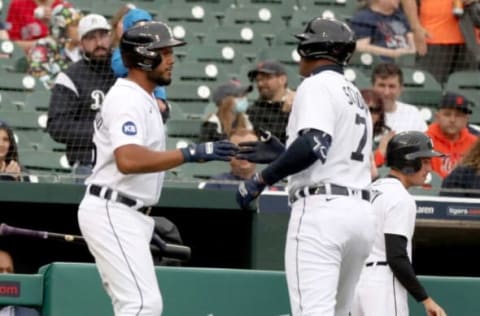 Tigers third baseman Jeimer Candelario (left) meets second baseman Jonathan Schoop (7) after he homered against Red Sox starting pitcher Nathan Eovaldi (not pictured) during first inning action Wednesday, April 13, 2022, at Comerica Park in Detroit.