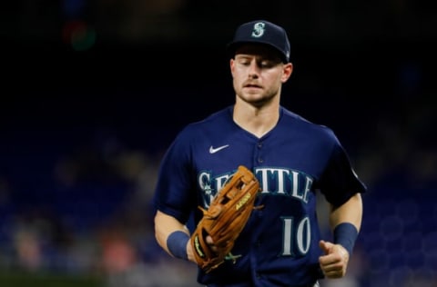 Apr 29, 2022; Miami, Florida, USA; Seattle Mariners center fielder Jarred Kelenic (10) runs to dugout after the seventh inning of the game against the Miami Marlins at loanDepot Park. Mandatory Credit: Sam Navarro-USA TODAY Sports