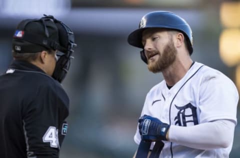 May 9, 2022; Detroit, Michigan, USA; Detroit Tigers left fielder Robbie Grossman (8) talks with umpire Nick Mahrley (48) after a called strike during the third inning against the Oakland Athletics at Comerica Park. Mandatory Credit: Raj Mehta-USA TODAY Sports