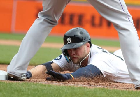 Detroit Tigers left fielder Austin Meadows (17) dives back to first base after his single against Colorado Rockies starting pitcher Chad Kuhl (not pictured) during third-inning action on Sunday, April 24, 2022, at Comerica Park in Detroit.Tigers Col3