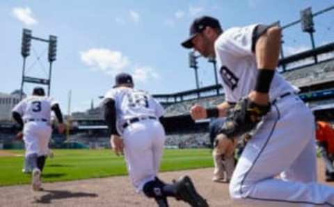 Apr 12, 2017; Detroit, MI, USA; Detroit Tigers second baseman Ian Kinsler (3) right fielder Tyler Collins (18) and center fielder Andrew Romine (17) take the field during the first inning against the Minnesota Twins at Comerica Park. Mandatory Credit: Rick Osentoski-USA TODAY Sports