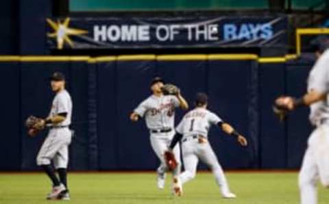 Apr 19, 2017; St. Petersburg, FL, USA;Detroit Tigers shortstop Jose Iglesias (1), Detroit Tigers center fielder JaCoby Jones (40) and Detroit Tigers second baseman Ian Kinsler (3) attempt to catch the fly ball as it gets lost in the catwalk during the third inning at Tropicana Field. Mandatory Credit: Kim Klement-USA TODAY Sports