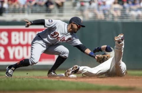 Apr 22, 2017; Minneapolis, MN, USA; Detroit Tigers shortstop Dixon Machado (49) tags out Minnesota Twins second baseman Brian Dozier (2) trying to steal second base in the first inning at Target Field. Mandatory Credit: Jesse Johnson-USA TODAY Sports