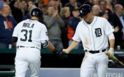 Apr 25, 2017; Detroit, MI, USA; Detroit Tigers first baseman Alex Avila (31) receives congratulations from right fielder Jim Adduci (37) after he hits a home run in the fourth inning against the Seattle Mariners at Comerica Park. Mandatory Credit: Rick Osentoski-USA TODAY Sports