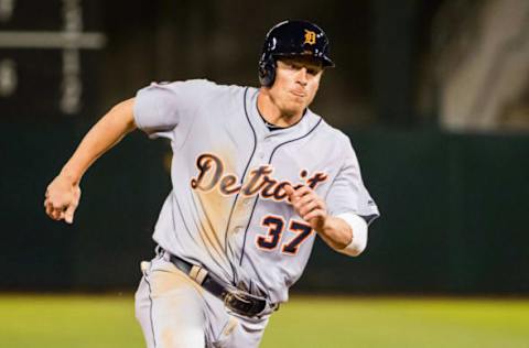 May 5, 2017; Oakland, CA, USA; Detroit Tigers right fielder Jim Adduci (37) rounds third base for a run against the Oakland Athletics during the eighth inning at Oakland Coliseum. Mandatory Credit: Kelley L Cox-USA TODAY Sports