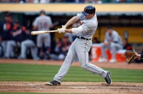 May 6, 2017; Oakland, CA, USA; Detroit Tigers center fielder Jim Adduci (37) hits a single against the Oakland Athletics during the third inning at Oakland Coliseum. Mandatory Credit: Stan Szeto-USA TODAY Sports