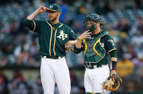 May 6, 2017; Oakland, CA, USA; Oakland Athletics starting pitcher Jesse Hahn (left) and catcher Stephen Vogt (right) look towards the bullpen during the fourth inning against the Detroit Tigers at Oakland Coliseum. Mandatory Credit: Stan Szeto-USA TODAY Sports