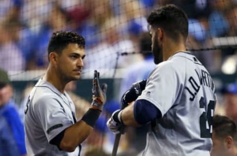 May 29, 2017; Kansas City, MO, USA; Detroit Tigers shortstop Jose Iglesias (left) is congratulated by right fielder J.D. Martinez (28) after scoring in the eighth inning against the Kansas City Royals at Kauffman Stadium. The Tigers won 10-7. Mandatory Credit: Jay Biggerstaff-USA TODAY Sports