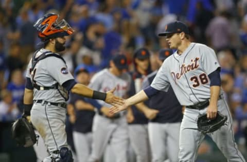 May 31, 2017; Kansas City, MO, USA; Detroit Tigers catcher Alex Avila (31) and relief pitcher Justin Wilson (38) celebrate after defeating the Kansas City Royals at Kauffman Stadium. The Tigers won 6-5. Mandatory Credit: Jay Biggerstaff-USA TODAY Sports