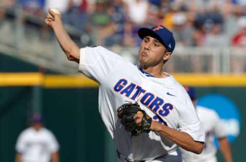 Jun 18, 2017; Omaha, NE, USA; Florida Gators pitcher Alex Faedo (21) throws against the TCU Horned Frogs in the first inning at TD Ameritrade Park Omaha. Mandatory Credit: Bruce Thorson-USA TODAY Sports